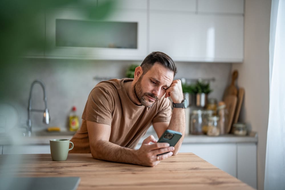 Man scrolling on his phone